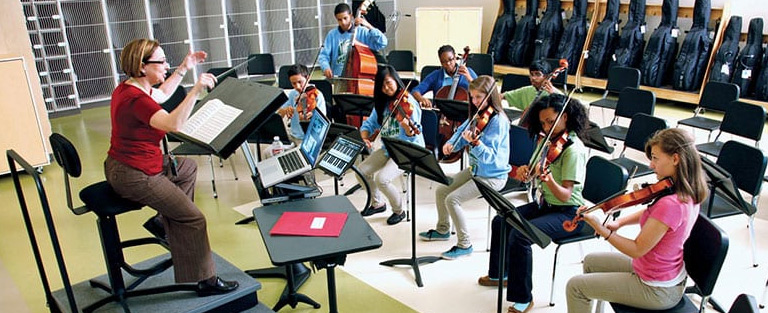 Students playing instrument during orf session